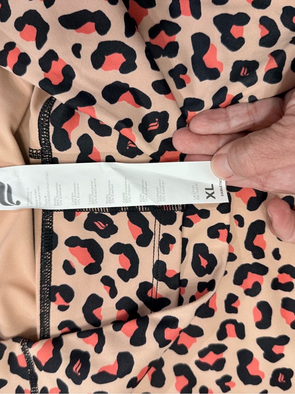 Fabletics Leopard Print Active Leggings in Peach and Black with Coral Accents